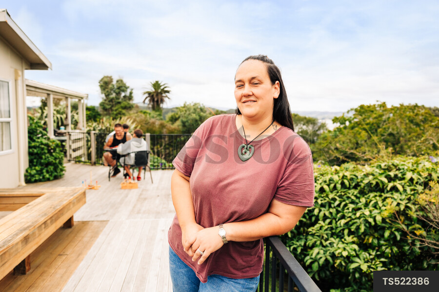 Woman leaning on deck railing