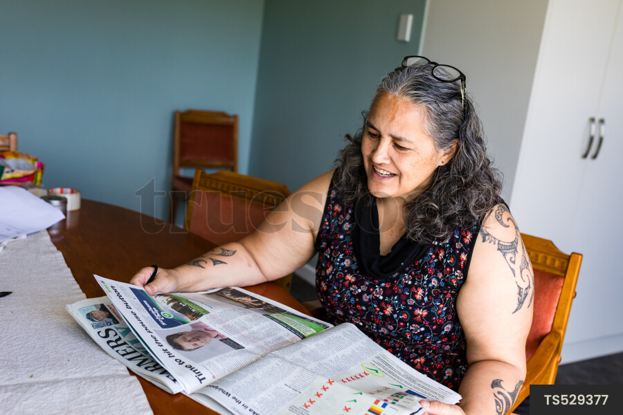 Woman Reading Newspaper