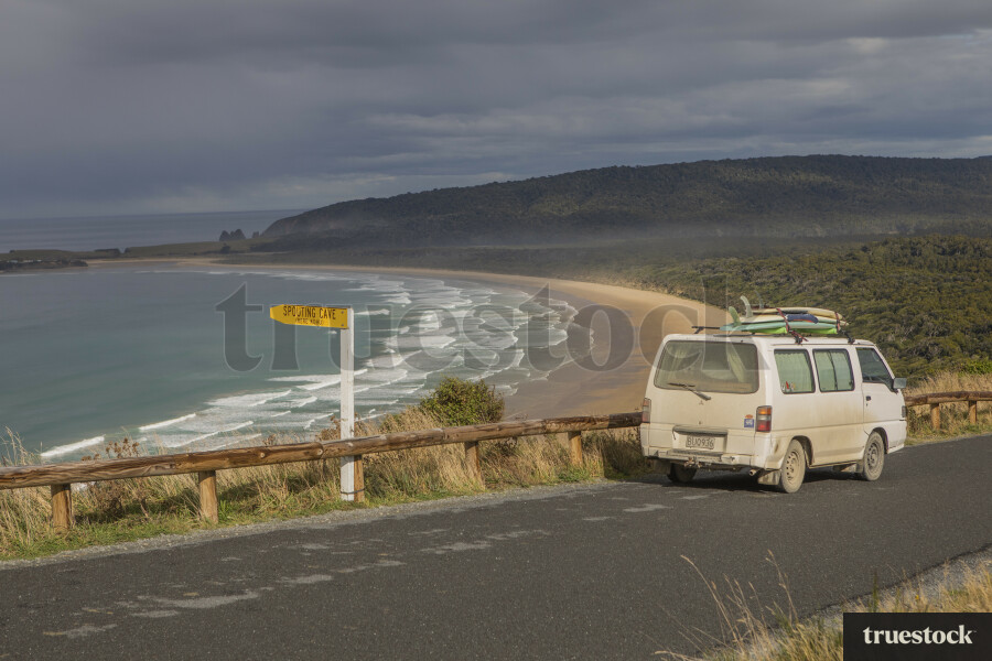 Surfing van above bay