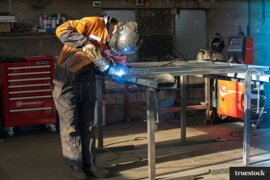 Welder in the engineering workshop working