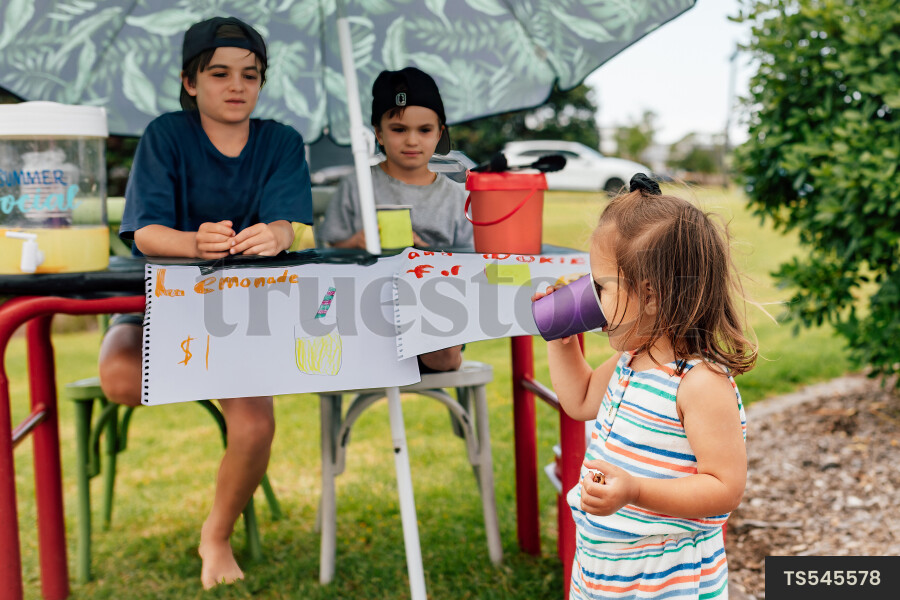 Kids Buying Lemonade at Lemonade Stand