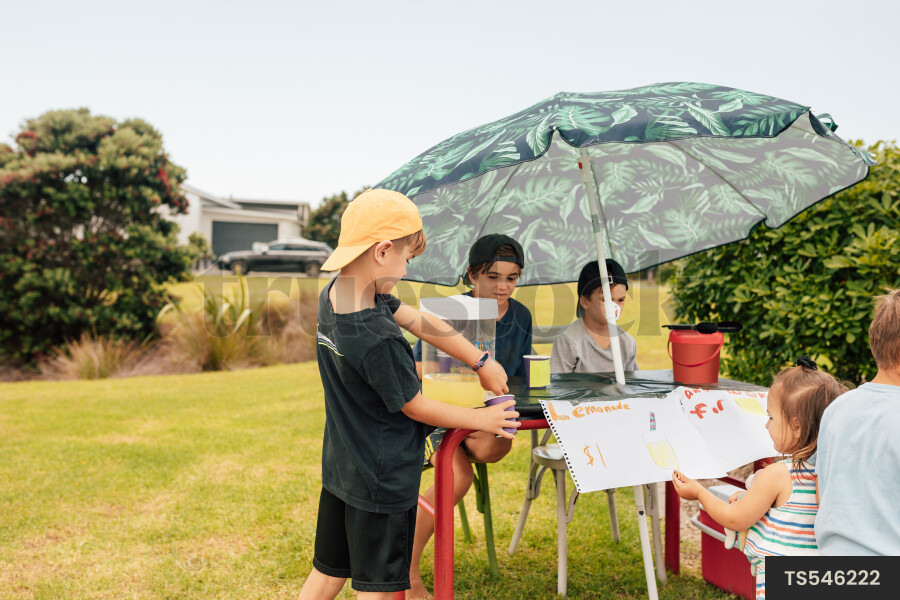 Kids Buying Lemonade at Lemonade Stand