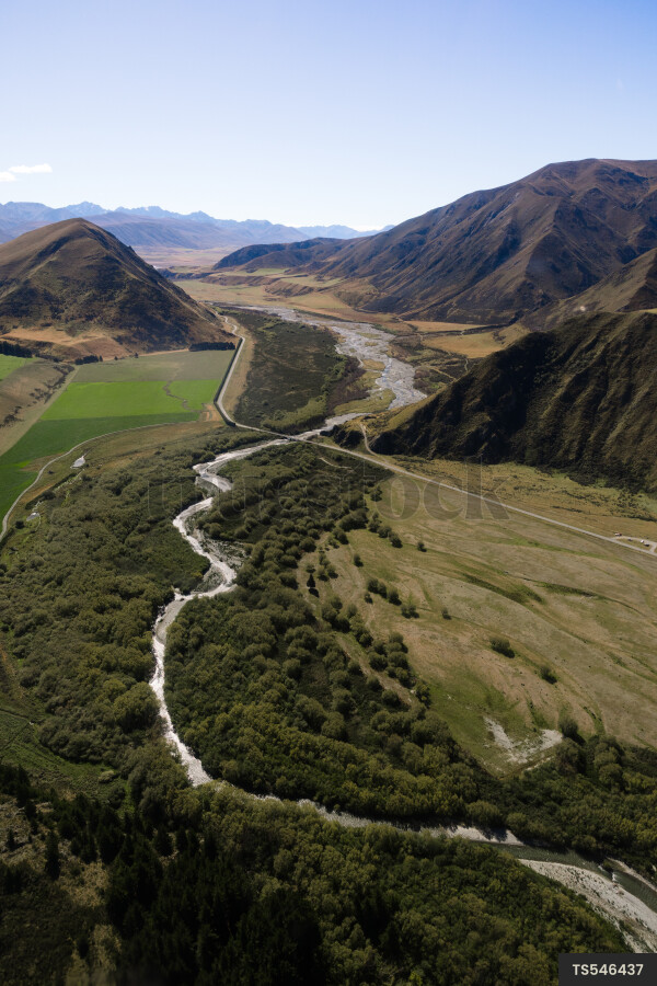 Aerial landscape of braided river through mountains