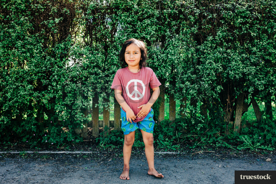 Portrait of a Māori boy in the backyard