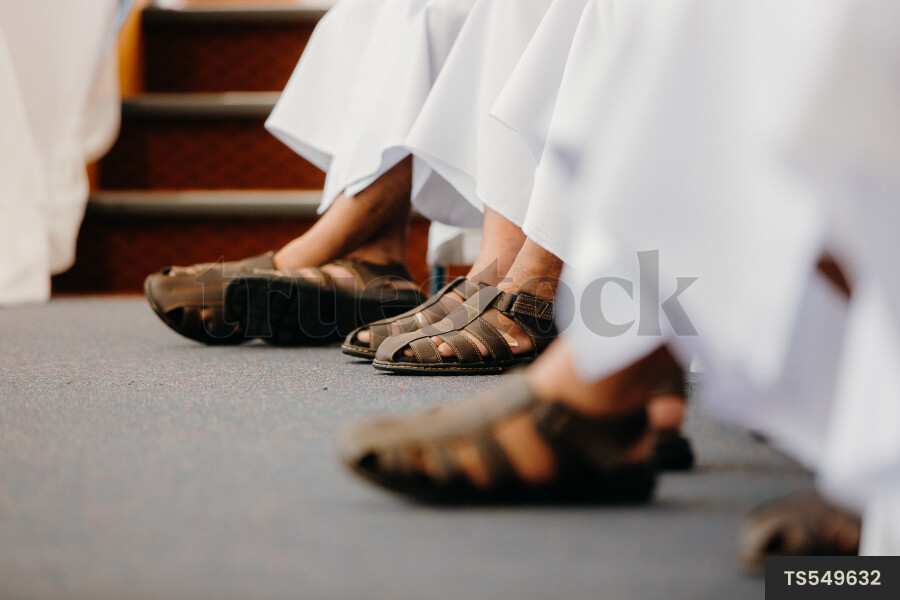 People wearing sandals to traditional wedding