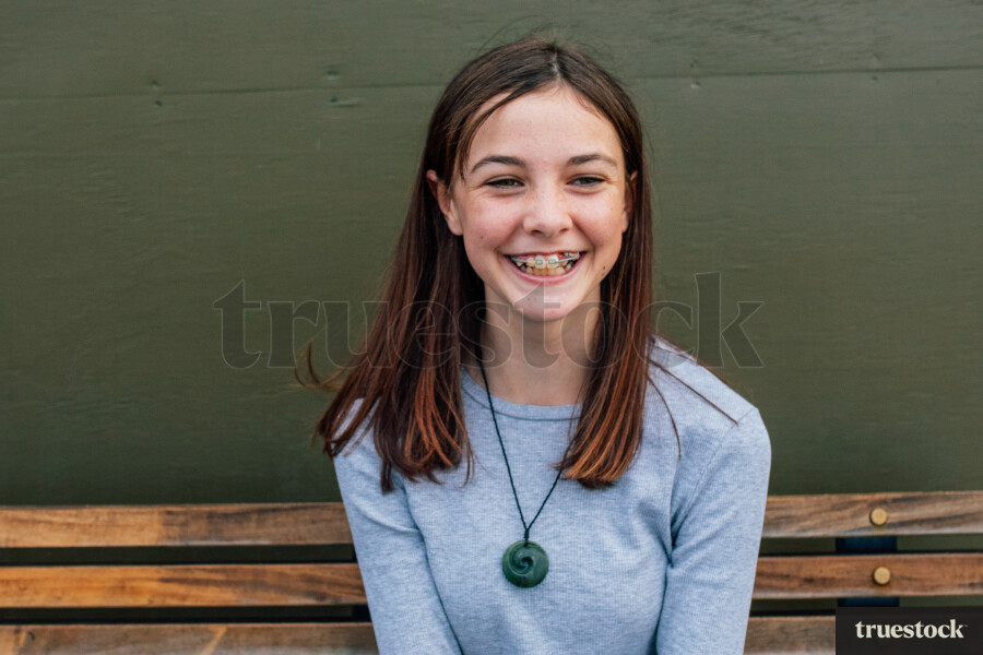 Teen Girl Sitting on Bench
