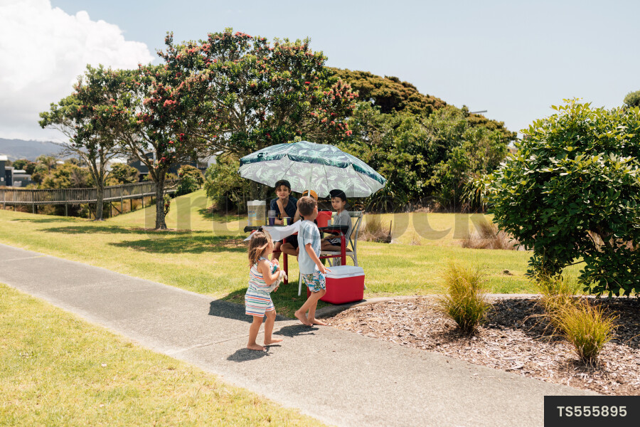 Kids Buying Lemonade at Lemonade Stand