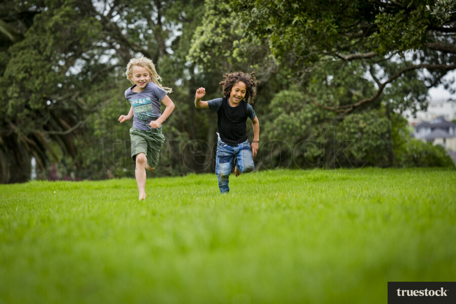 Children running on field