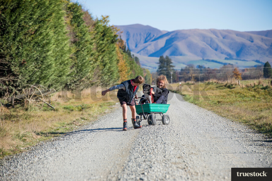 Boy Giving his Mum a Wagon Ride
