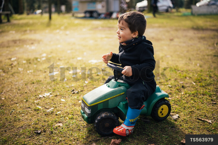 Young Boy on Toy Car