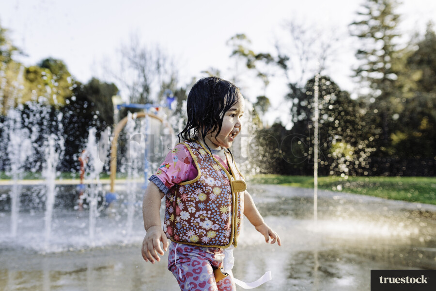 Young Girl Playing in Water