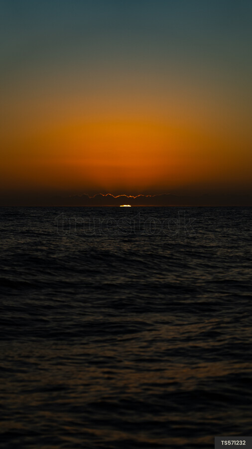 Sunset over sea in Haast