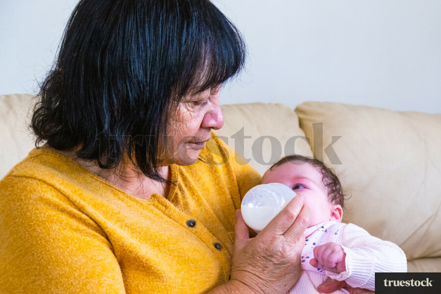 Grandma Feeding her Granddaughter