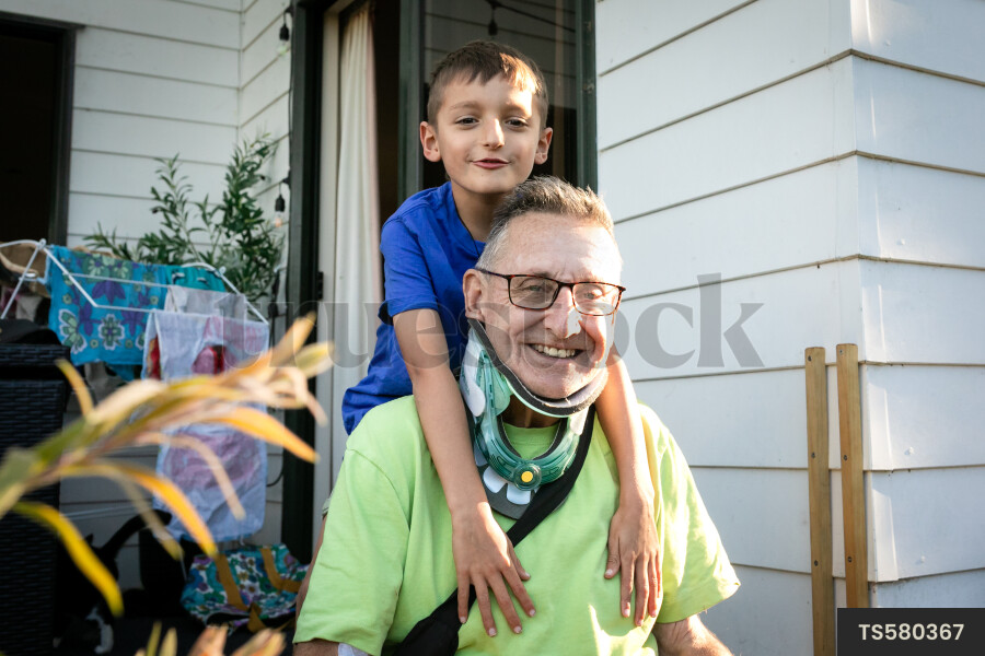 Smiling man with his grandson