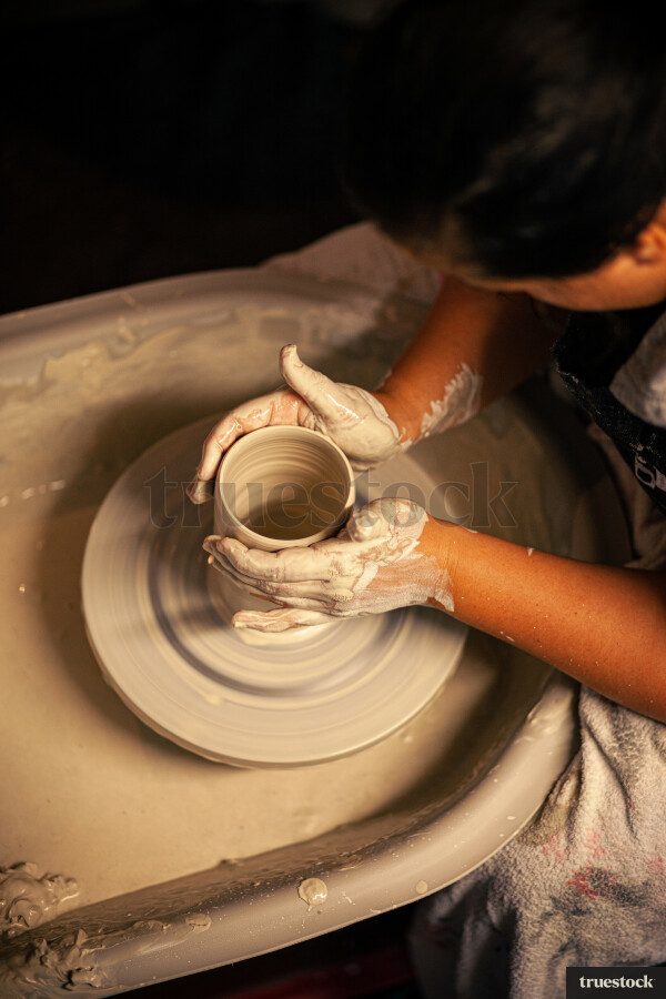 Woman making pottery