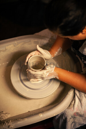 Woman making pottery