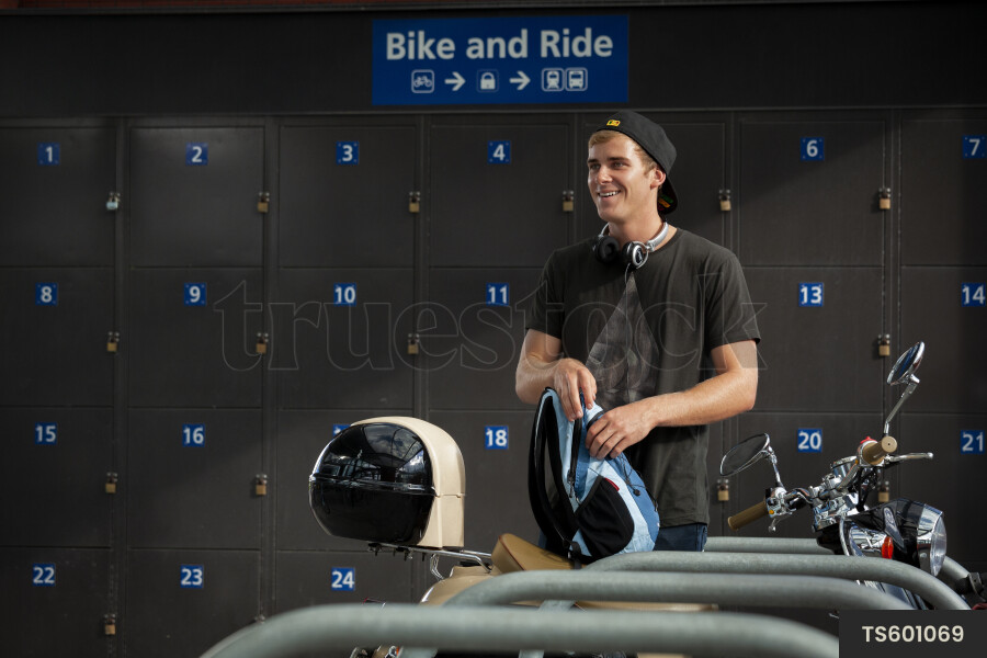 Man Packing Backpack by Bikes