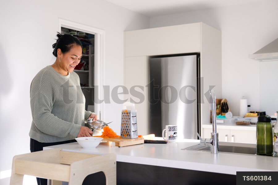 Woman cooking in kitchen