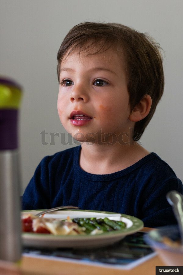Child eating food at the table