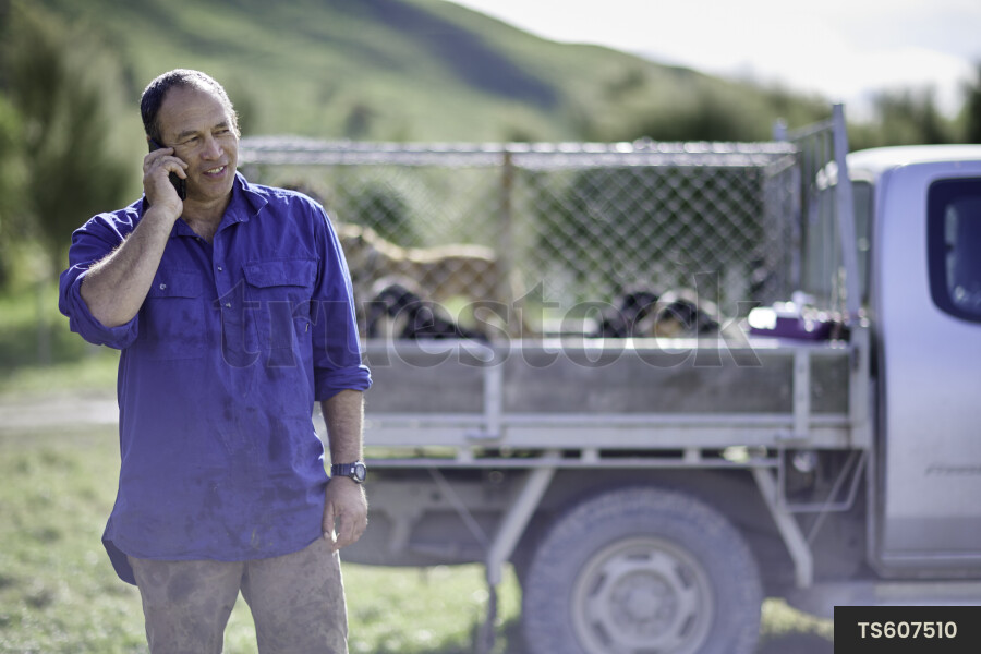Farmer Using Phone at Work