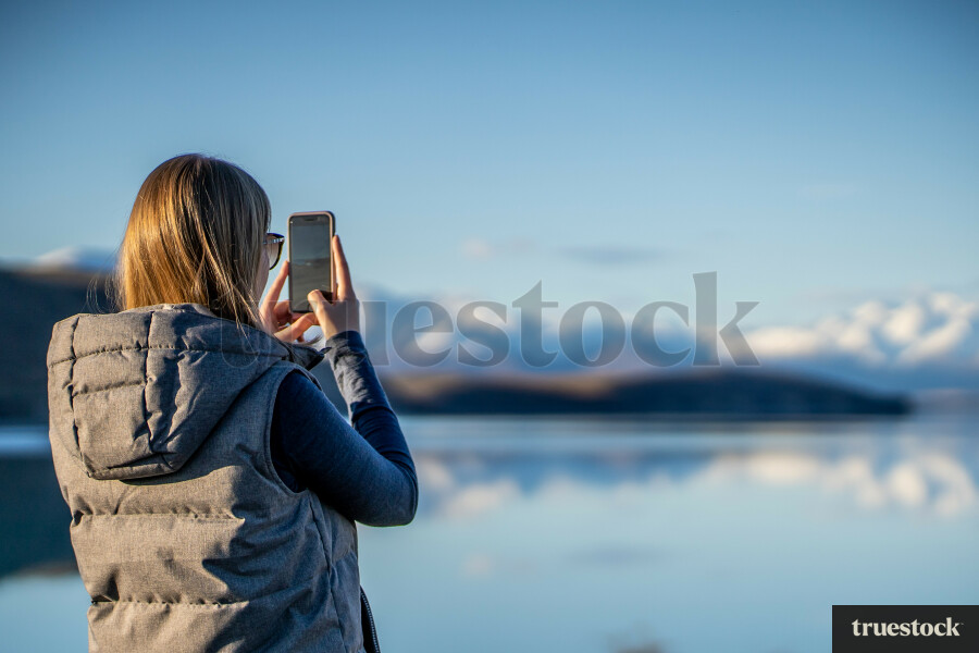 Woman taking picture on phone
