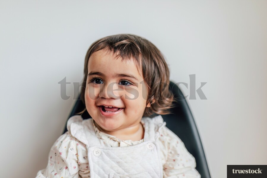 Young Girl Sitting on Chair