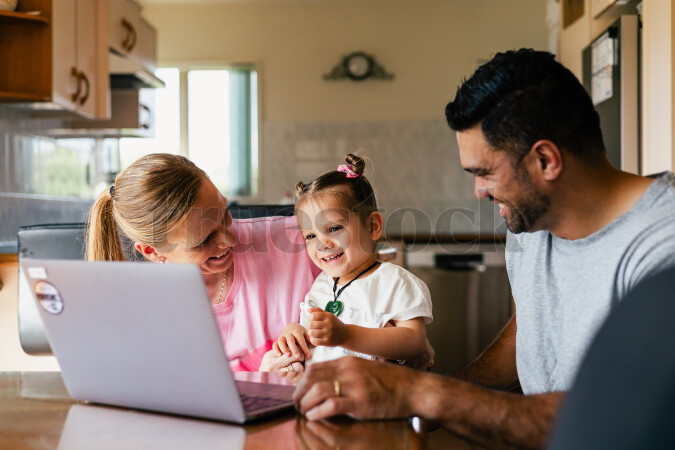 Parents Using Laptop