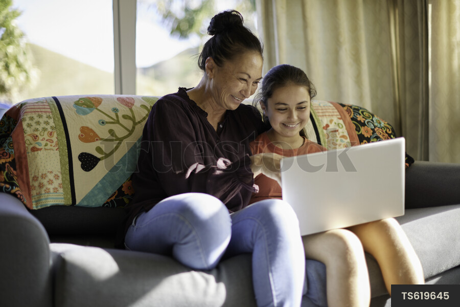 Mother and Daughter Using Laptop