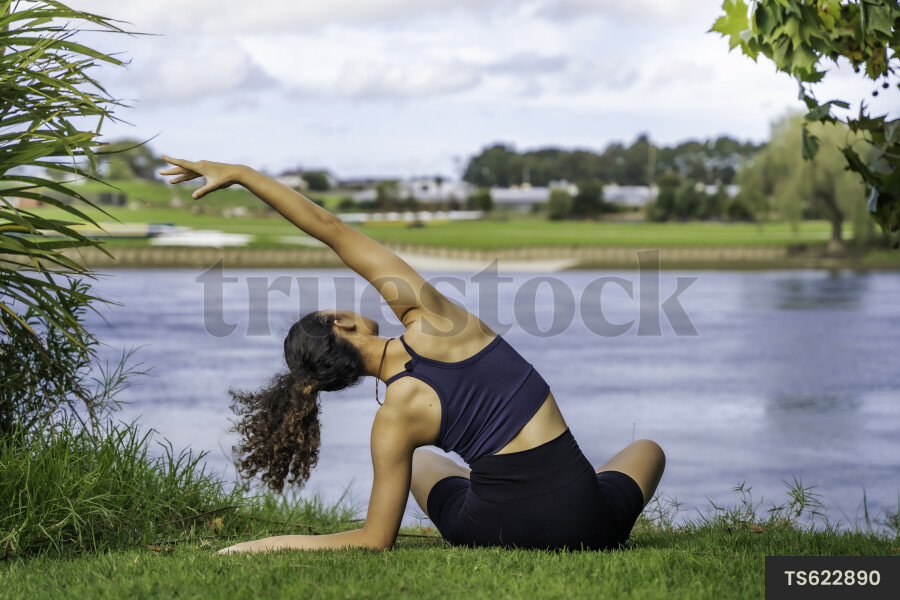 Teen Girl Doing Yoga in Park