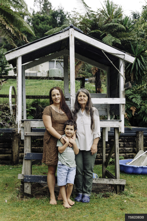 Family By Wooden Playhouse