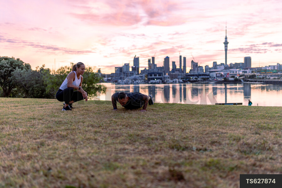 Couple exercising in park