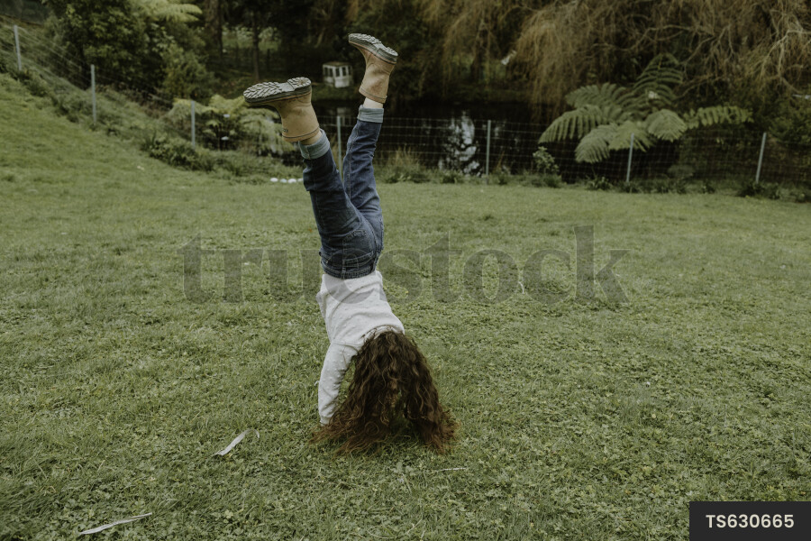 Young Girl Doing a Cartwheel