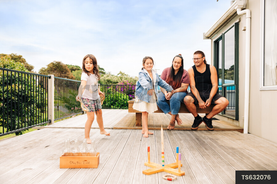 Family playing on deck