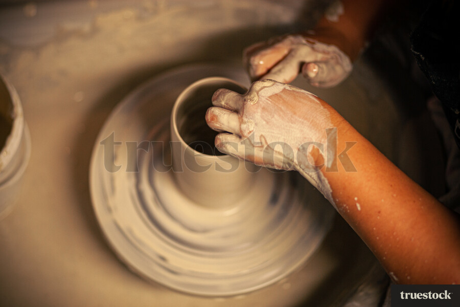 Woman making pottery