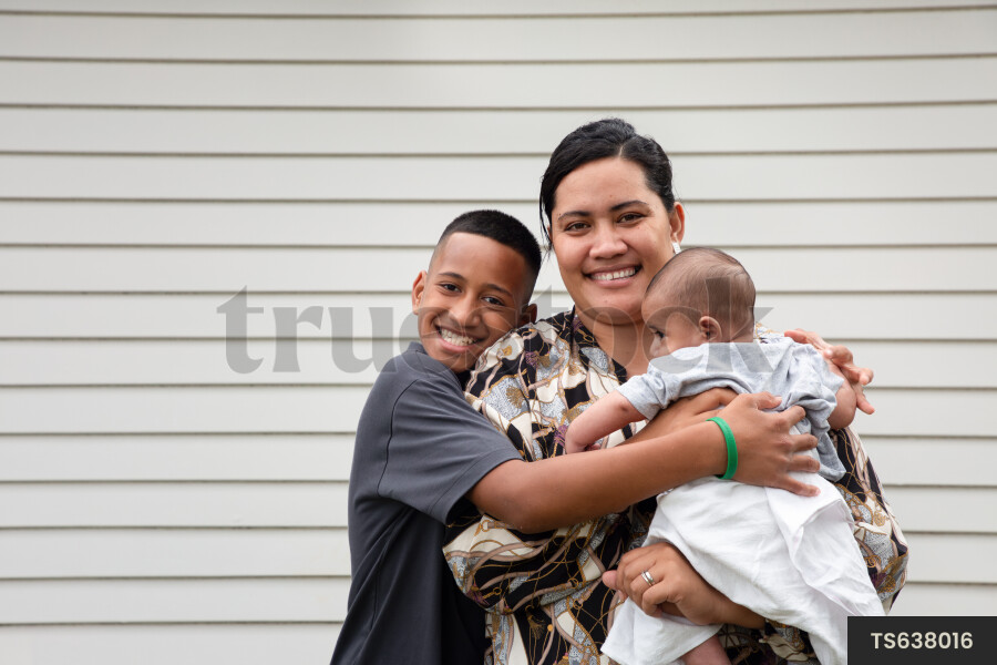 Portrait of happy tongan mother with sons