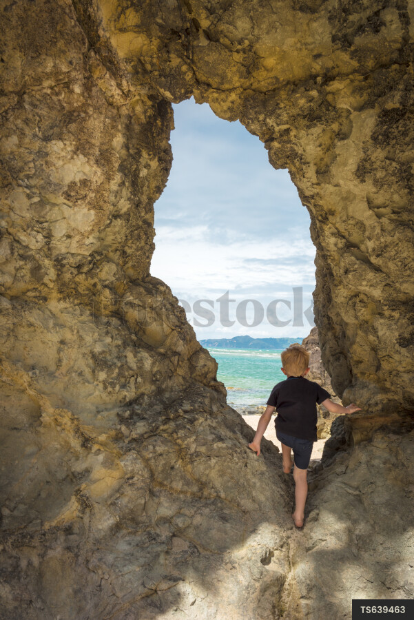 Boy in Tunnel at Beach