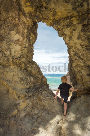 Boy in Tunnel at Beach