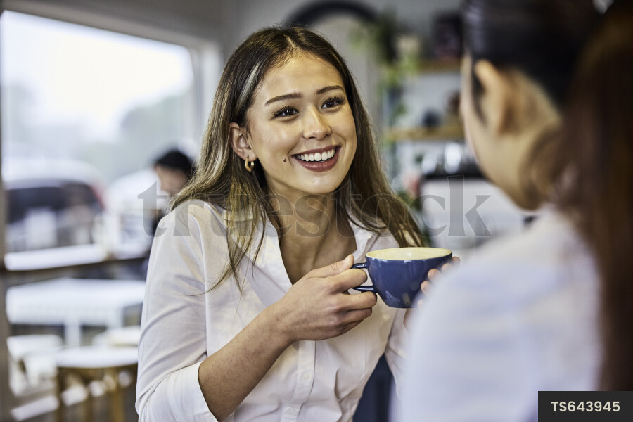 Remote coworkers with coffee in cafe