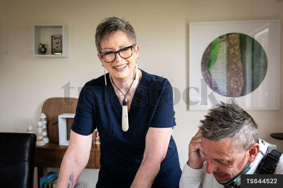 Health carer and patient with neck brace