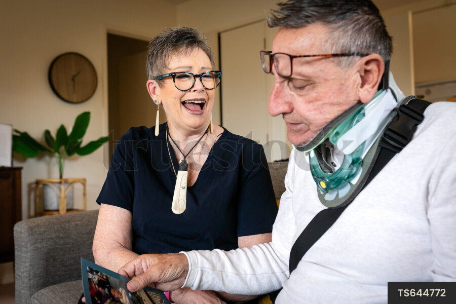 Health carer and patient with photo album