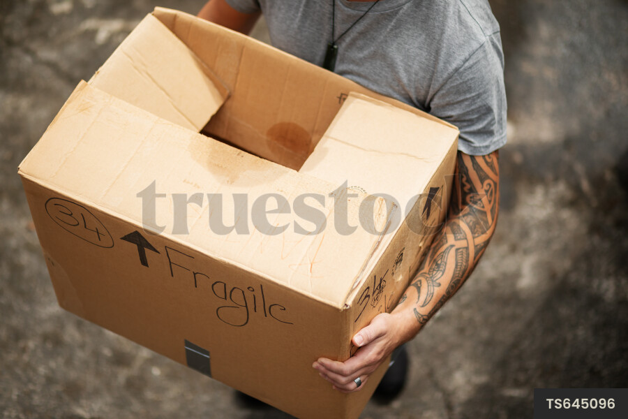 Man carrying cardboard box