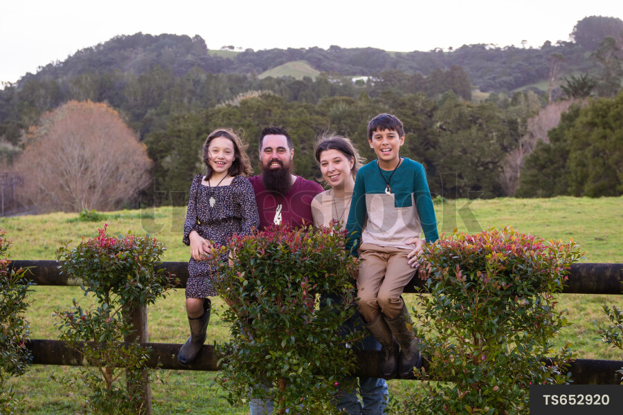 Family on Fence