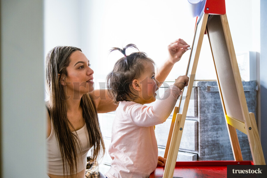 Toddler Drawing on her Easel