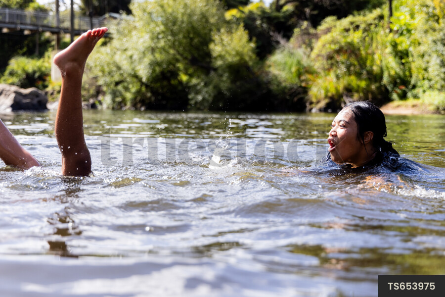 Children swimming in river