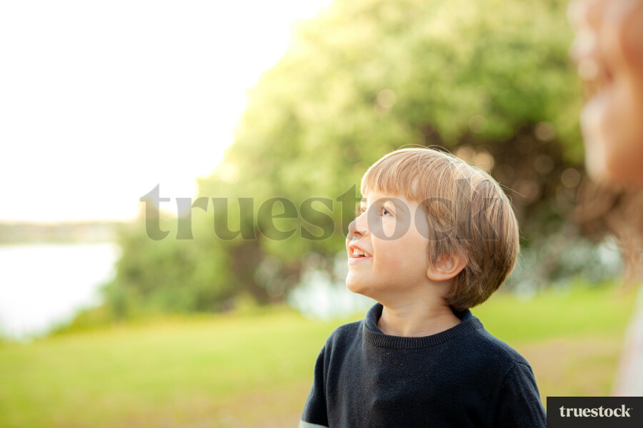 Portrait of smiling child looking up into the distance