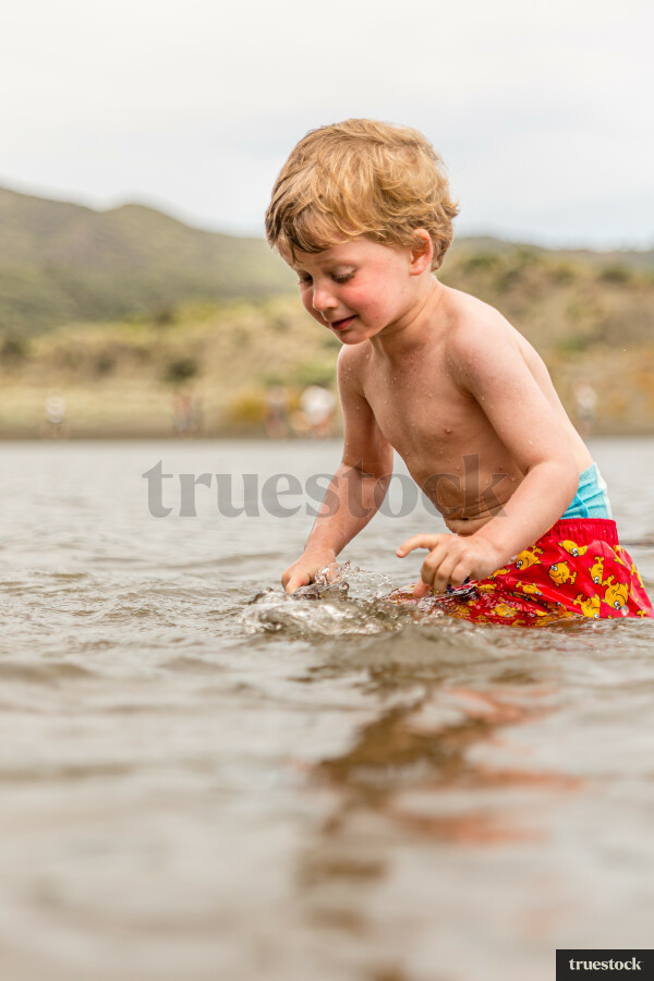 Toddler in the water at the beach
