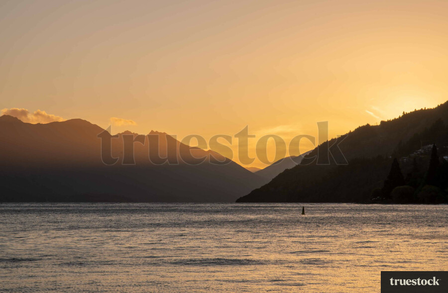 Sunset at the lake with mountain ranges