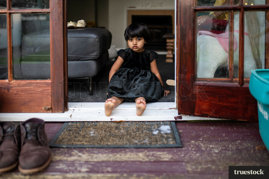 Little Girl Sitting in the Entrance