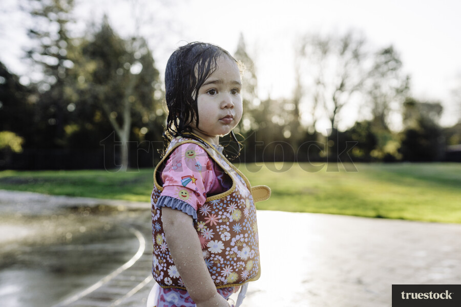 Young Girl Playing in Water