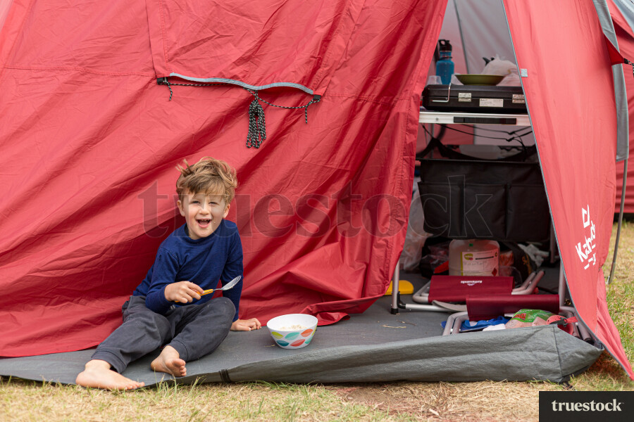 Child eating breakfast at Kai Iwi lakes